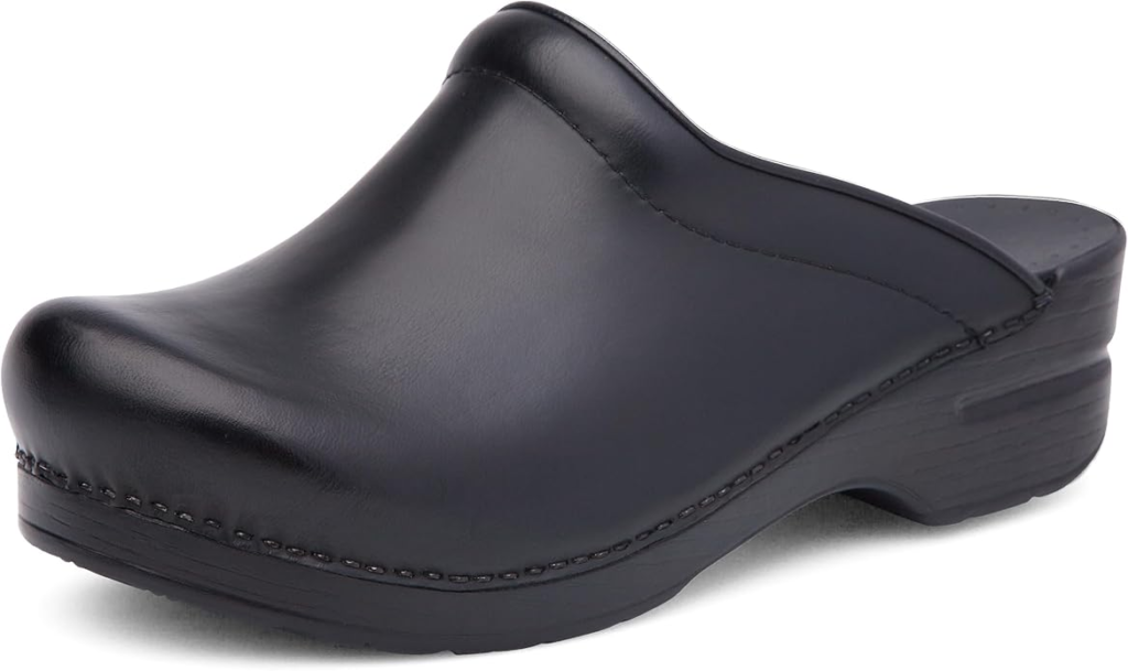 Dansko Women's Sonja mule in black cabrio leather with APMA-accepted rocker bottom PU outsole and padded instep collar for plantar fasciitis relief